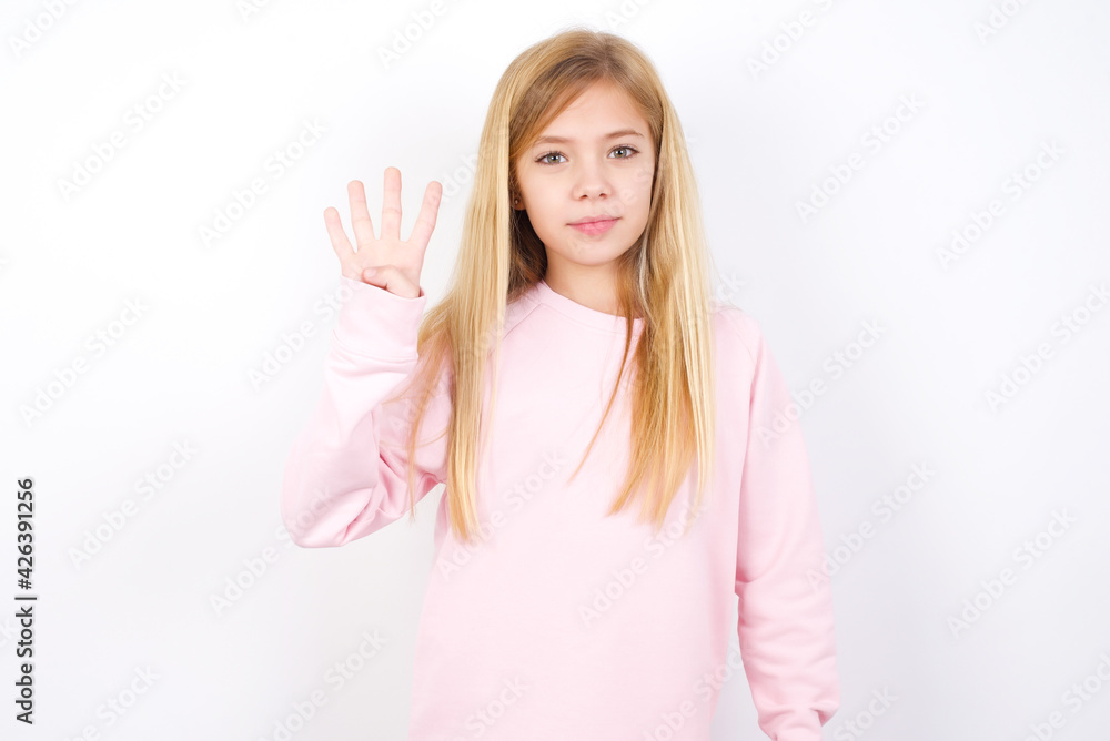 beautiful caucasian little girl wearing pink hoodie over white background showing and pointing up with fingers number four while smiling confident and happy. beautiful caucasian little girl wearing pink hoodie over white background showing and pointing up with fingers number four while smiling confident and happy.