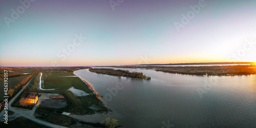 Canvas Print panoramic aerial view of sunrise over the river with the view of an island