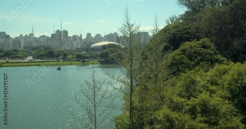 Aerial rising shot of Ibirapuera park with unrecognizable people exercising photo