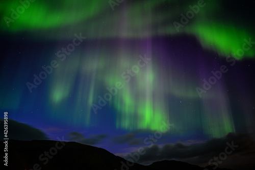 The dancing northern lights of the Aurora Borealis above Landmannalaugar, Fjallabak Nature Reserve, Iceland 