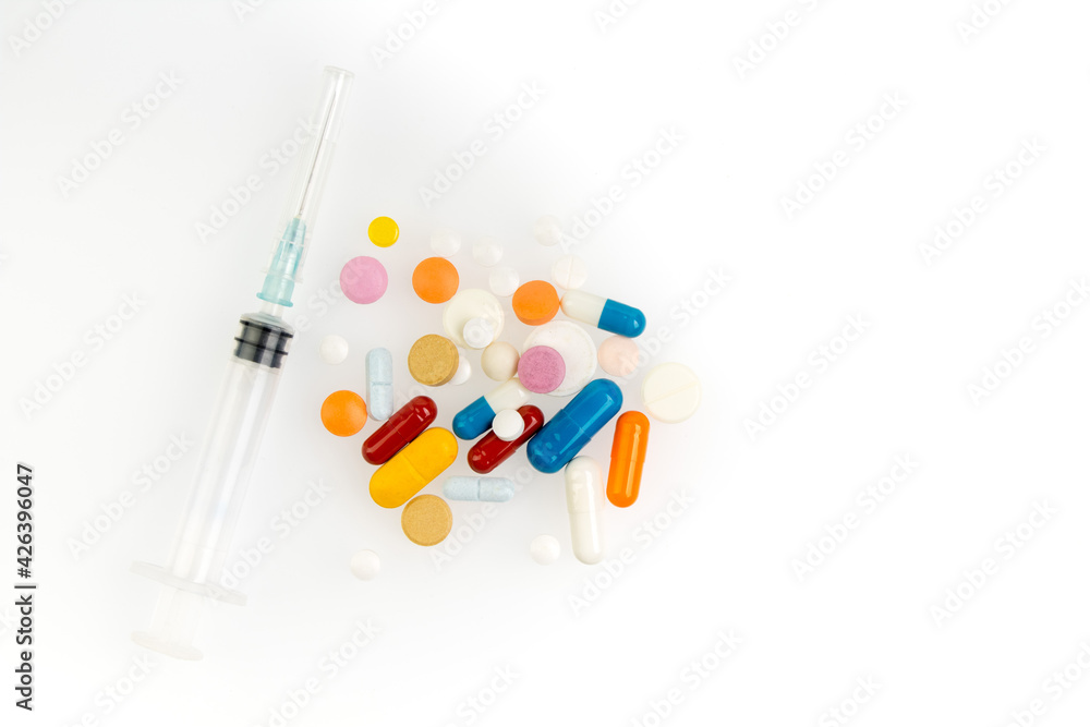 Set of different colorful pills and capsules isolated on white background. Copy space for text. Set of different colorful pills and capsules isolated on white background. Copy space for text.
