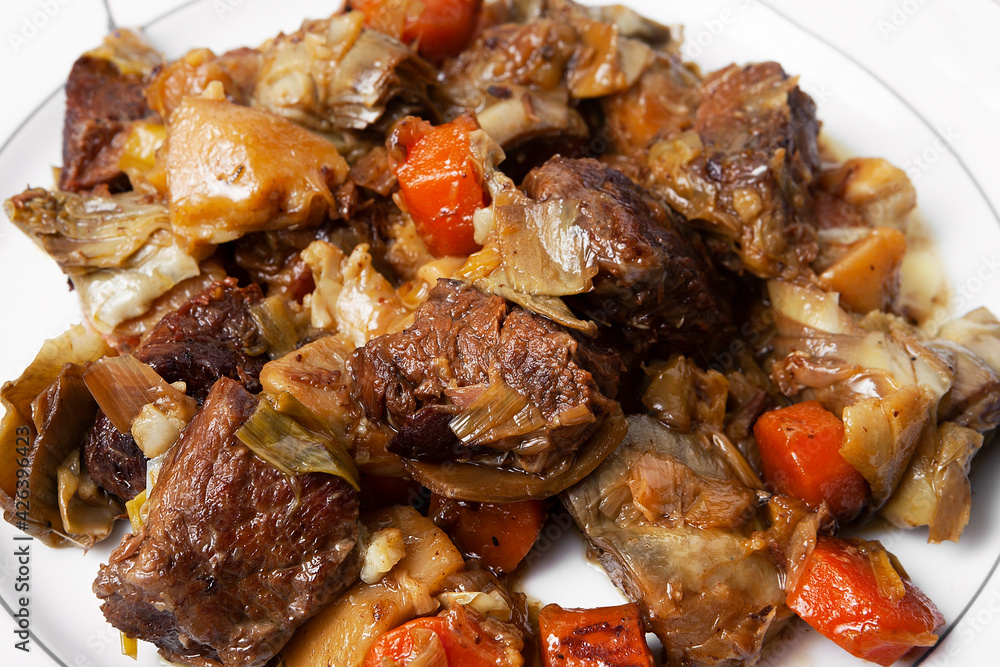 close-up of a pre-cooked beef Ragout with vegetables dish on a plate close-up of a pre-cooked beef Ragout with vegetables dish on a plate