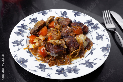 Homemade dish prepared of beef Ragout with vegetables. Homemade food concept.