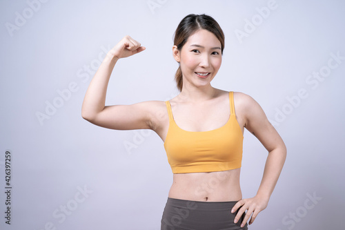 Asian women in yellow sportswear  Isolated on white background  Concept of health care and exercise.