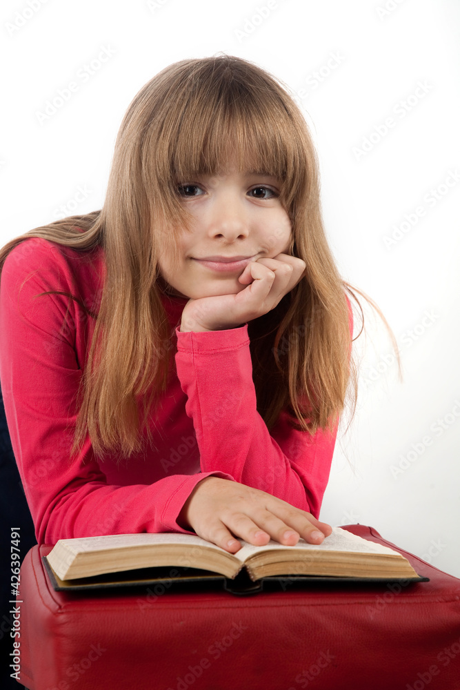 girl 10 years old keeps book smiles on white background portrait in studio girl 10 years old keeps book smiles on white background portrait in studio