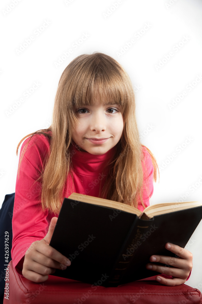 girl 10 years old keeps book smiles on white background portrait in studio girl 10 years old keeps book smiles on white background portrait in studio