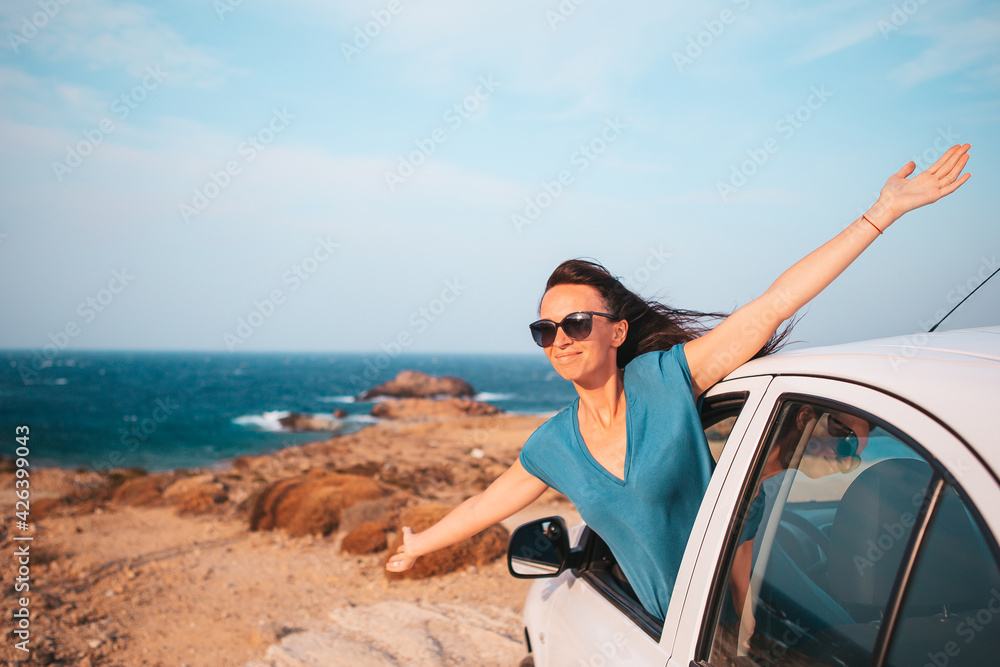 Young woman on vacation travel by car.