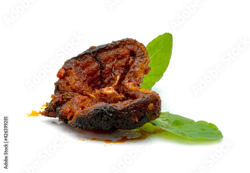 Stir Fried Crispy Catfish with Curry and leaf fresh basil isolated on white background