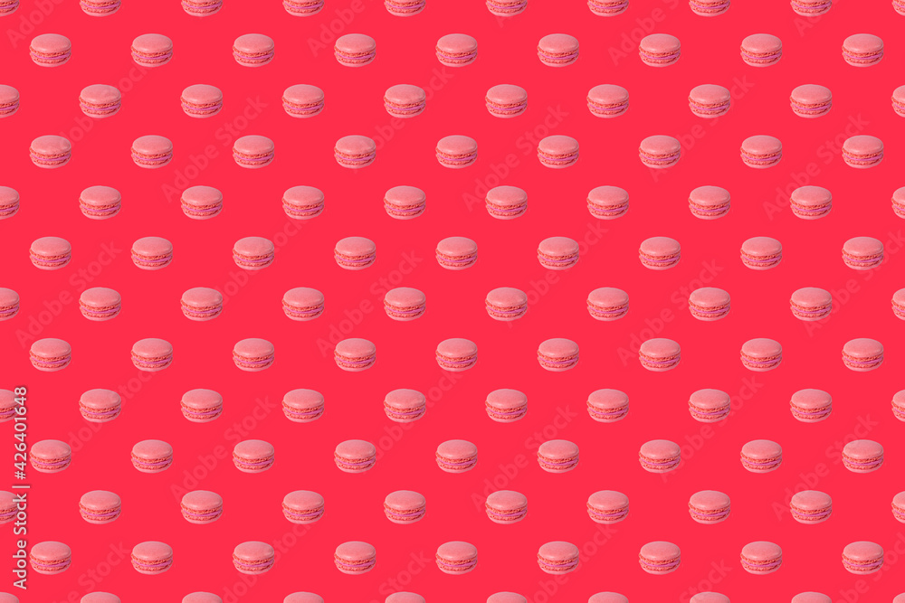 seamless pattern. pink macaroon pattern  on a red background. French almond cookies dessert, top view. Wrapping paper, poster