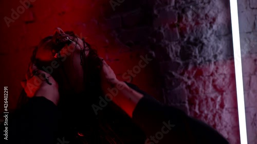 The devilish female vampire is the reincarnation of an entity within the body. Scary witch face on spooky Halloween