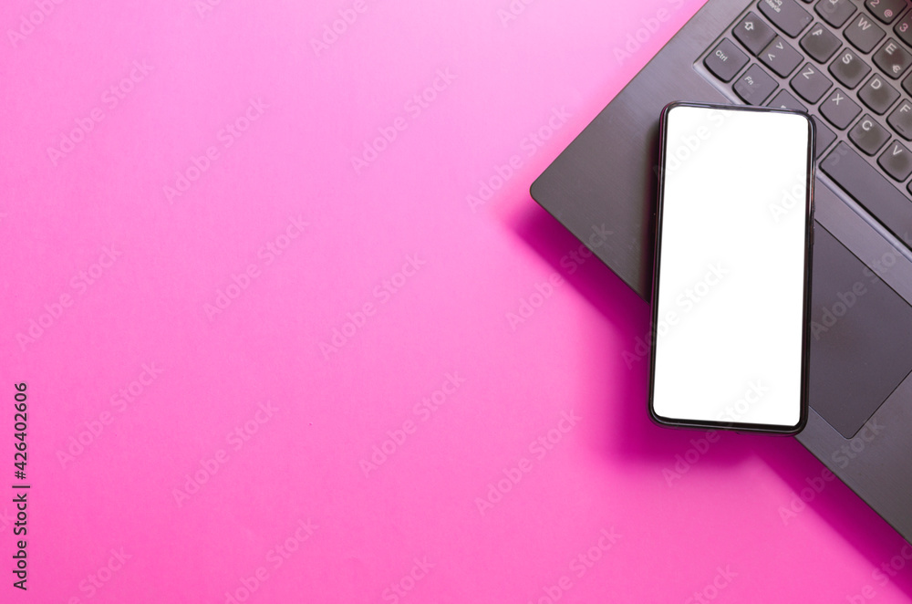 Computer, laptop, smartphone isolated screen on pink background workspace Computer, laptop, smartphone isolated screen on pink background workspace