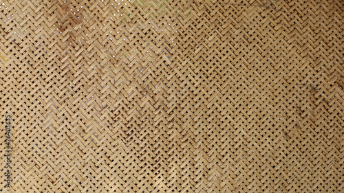 Weave pattern background and bamboo texture. The ancient classic pattern of bamboo wickerwork is part of traditional Thai appliances for the background and wallpaper. Selective focus