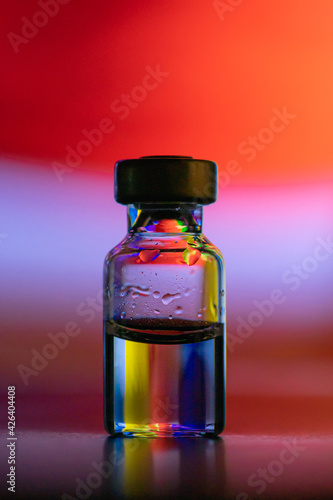 vaccine bottle in color background