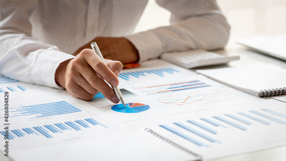 Businessman hands hold documents with financial statistic stock photo,discussion and analysis data the charts and graphs. Finance concept Businessman hands hold documents with financial statistic stock photo,discussion and analysis data the charts and graphs. Finance concept
