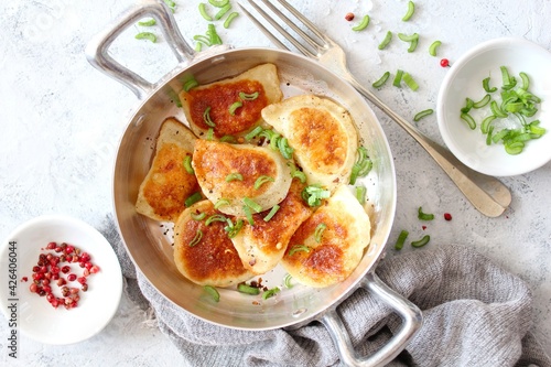 Homemade fried ravioli. Fried polish potato pierogis. Top view with copy space. Vegetarian and vegan food.