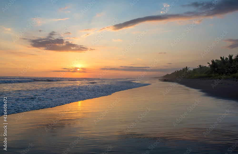 Beautiful sunset sky on the beach in Matapalo, Costa Rica. Central America. Sky background on sunset. Tropical sea.