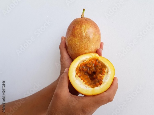 Passion fruit and an open fruit in which the pulp is clearly visible. (Passiflora edulis) Passiflora family. Manaus Amazonas, Brazil photo