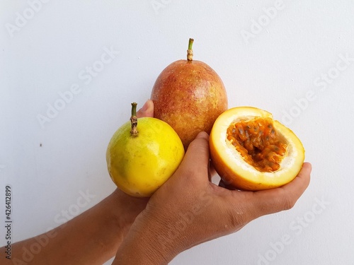 Passion fruit and an open fruit in which the pulp is clearly visible. (Passiflora edulis) Passiflora family. Manaus Amazonas, Brazil photo