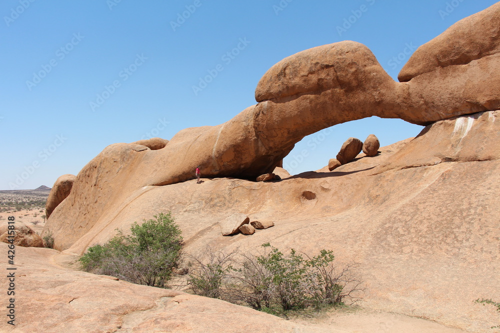 a hole in a mountain near spitzkoppe in namibia