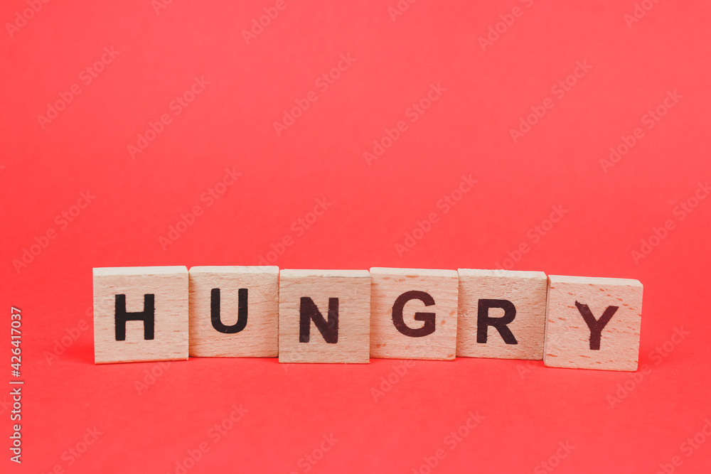 hungry word written in wooden letters hungry word written in wooden letters
