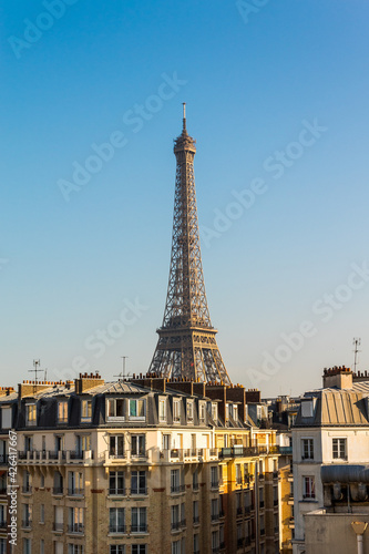 Eiffel tower behind the houses © Artem