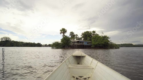 white boat on the oiapoque river amapa amazon brazil rainforest filmed with sony A7iii