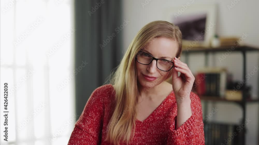 Pleasant lady taking off eyeglasses Pleasant lady taking off eyeglasses