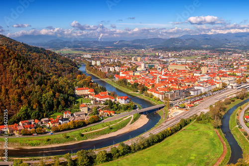 Scenic aerial view of the Celje city in Slovenia, Styria from old castle ancient walls. Amazing landscape with town in Lasko valley, river Savinja and blue sky with clouds, outdoor travel background