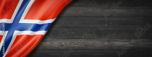 Norwegian flag on black wood wall banner photo