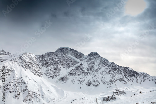 Glacier in the form of the number 7 on a mountain peak. North Caucasus, Kabardino-Balkaria, Elbrus, Russia. © Kirill Sergeev