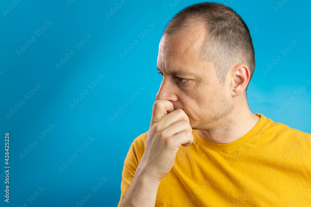 handsome man doubting isolated over blue background handsome man doubting isolated over blue background