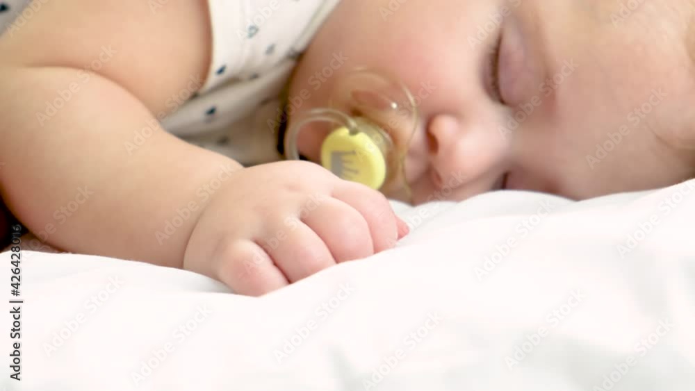 baby sleeps in a crib. selective focus. baby sleeps in a crib. selective focus.