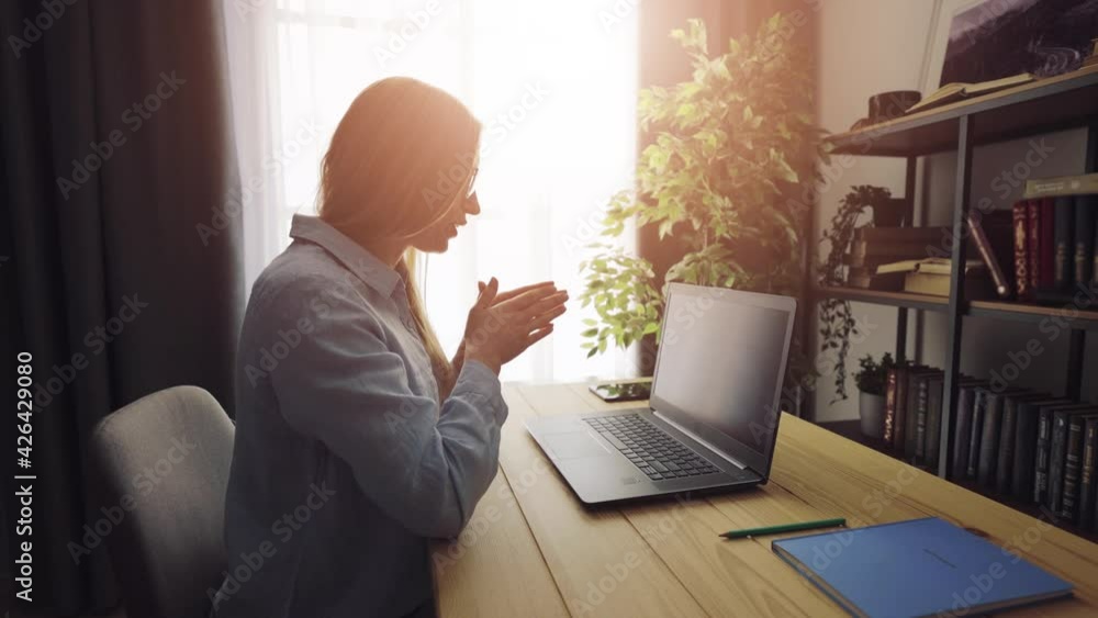 Woman using laptop for communication Woman using laptop for communication
