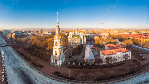 Aerial top view to St. Nicholas Naval Sea Cathedral in sunny day. Panorama of evening historical city center. Orthodox church located on banks of Kryukov and Griboyedov canal. Saint Petersburg. Russia