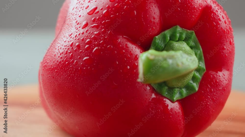 Bulgarian pepper in drops of water on the board. The camera's movement ...