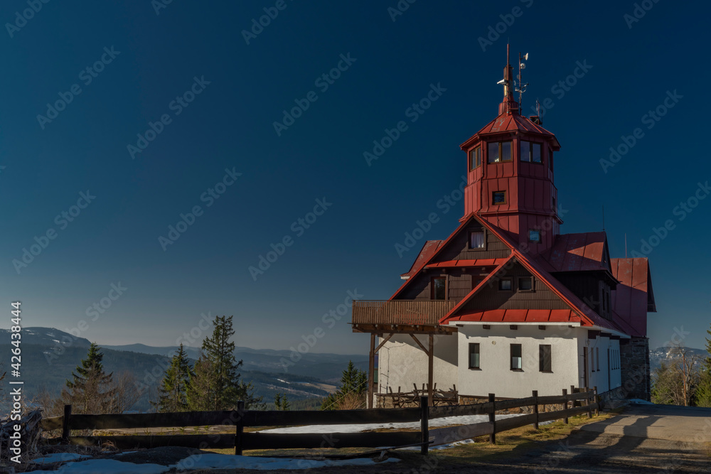 Naklejka premium Pancir hill with building with red roof in spring winter sunny morning