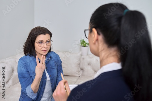 Middle-aged female at consultation of professional psychologist