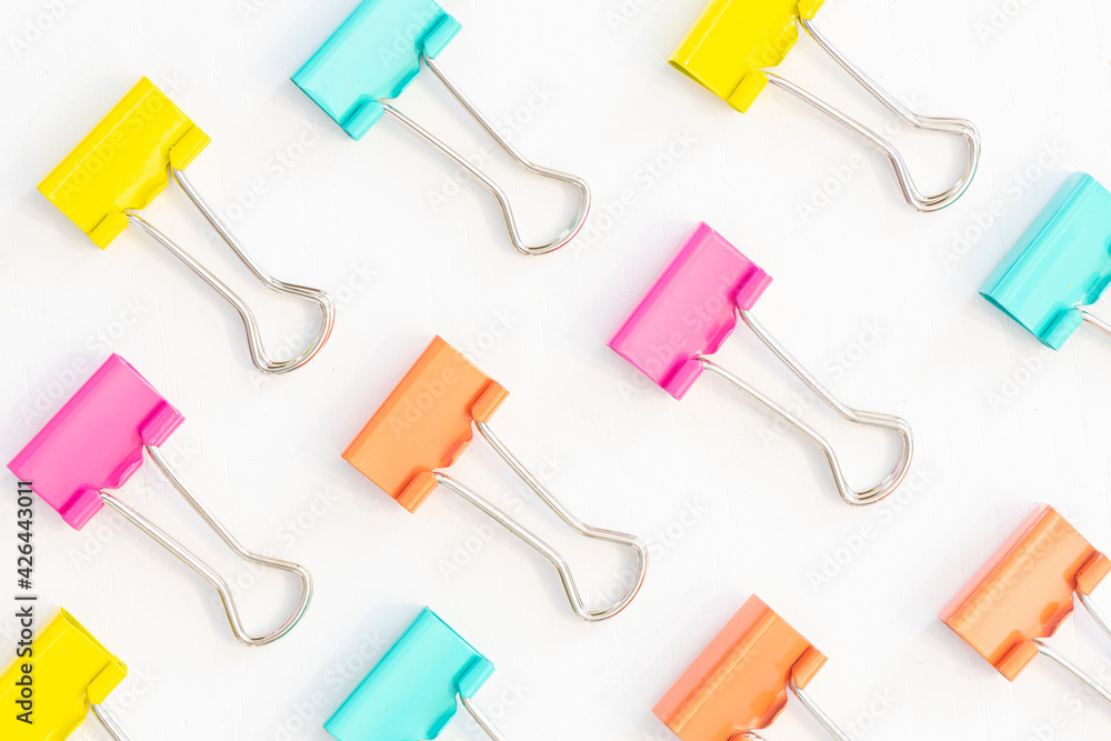 Multicolored binder clips isolated on white background Multicolored binder clips isolated on white background