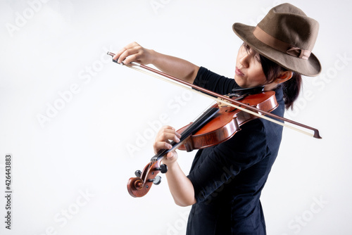 Young Asian woman elegant musician playing the violin in classical music on white background.