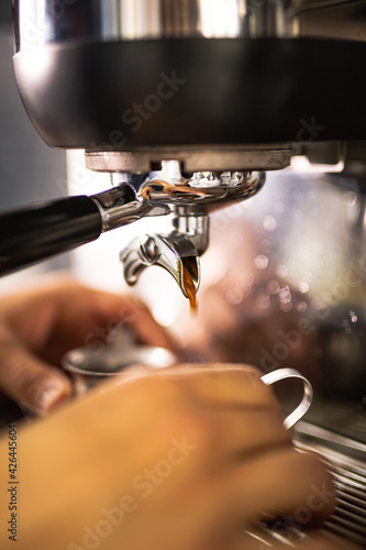 preparation of a coffee with machine and barista