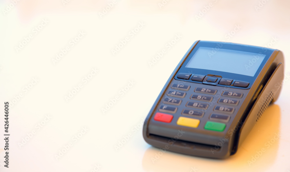 Close-up machine to pay credit card. Credit card reader swipe through terminal for payment. Paying by credit card. Close-up machine to pay credit card. Credit card reader swipe through terminal for payment. Paying by credit card.