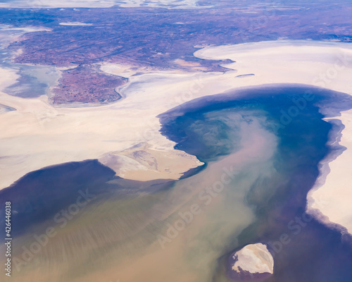 Beautiful aerial view of Lake Eyre, officially known as Kati Thanda - Lake Eyre, an endorheic lake in the outback of South Australia, including Stuarts Creek and Silcrete Island