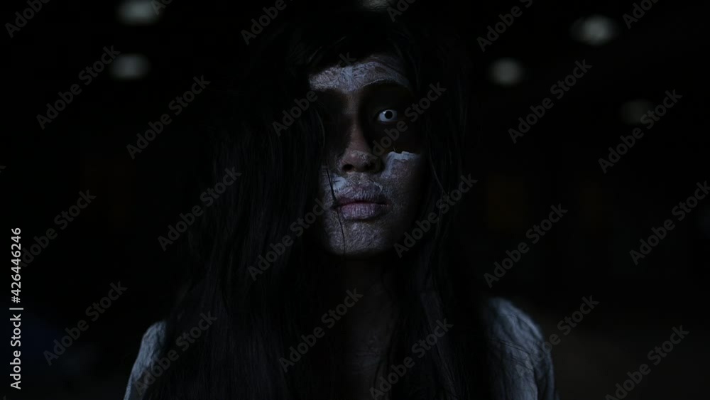 Portrait of asian woman make up ghost face,Horror scene,Scary background,Halloween poster Portrait of asian woman make up ghost face,Horror scene,Scary background,Halloween poster