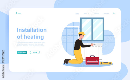 Cheerful male plumber is installing new heating system