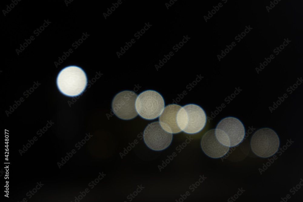 background with defocused lights at night, string of lights background with defocused lights at night, string of lights