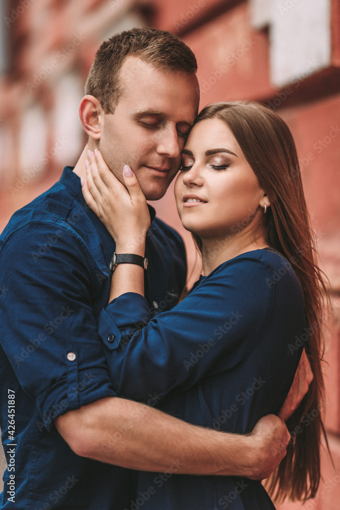 Happy young couple. The concept of a happy family with strong feelings. Young people in love Happy young couple. The concept of a happy family with strong feelings. Young people in love