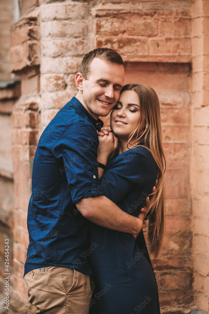 Happy young couple. The concept of a happy family with strong feelings. Young people in love Happy young couple. The concept of a happy family with strong feelings. Young people in love