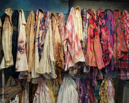 Two Wall Racks of Vintage Grunge Clothing