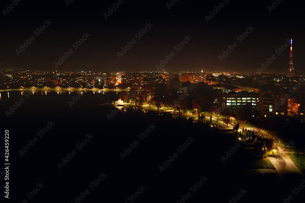 Panoramic night view of city with beautiful lights and incredible building. Concept of beautiful view building and lighted road at night.