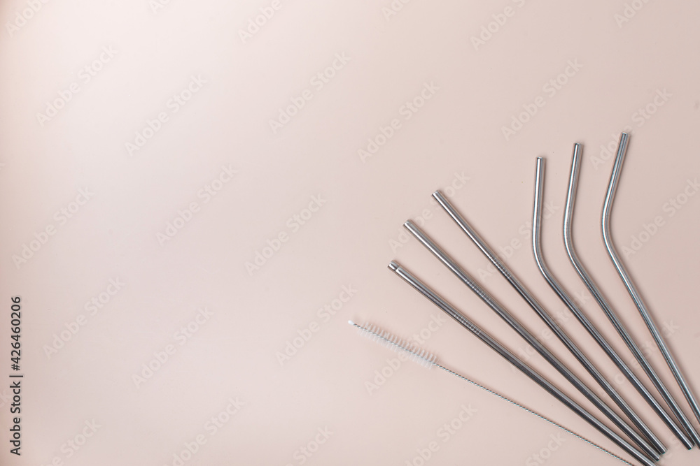 High angle view of six metal drinking straws arranged High angle view of six metal drinking straws arranged